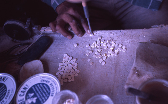Hearst Museum object titled Color slide, accession number 25-2054, described as Leonard Bateman, Pomo, making clamshell beads