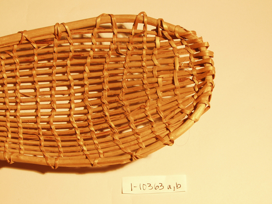 Hearst Museum object 2 of 8 titled Racket, accession number 1-10363a,b, described as Basket racket;  warp is Willow (Salix), weft is Maple (Acer macrophyllum). Open plain twined, peeled shoots, with no decoration.