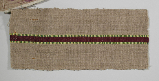 Hearst Museum object titled Textile fragment, accession number 5-11023, described as Textile sample (section of narrow band weaving). Brown-beige ground with central .8 cm maroon stripe flanked by stripes of yellow and green horizontally stripped threads.