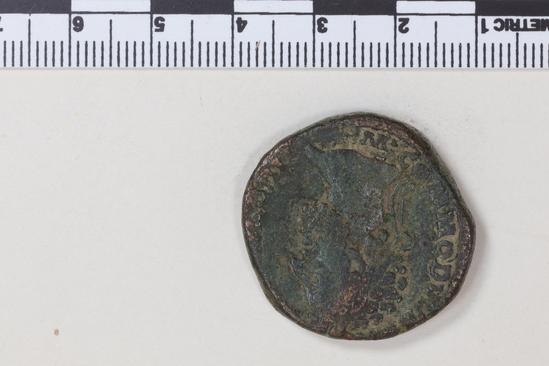 Hearst Museum object 5 of 6 titled Coin: æ sestertius, accession number 8-6480, described as Coin: Sestertius; Æ; Commodus Ru. Aequit[a]s - 24.4 gm. Obverse: M COMMODVS A[NT P FELIX AVG BRIT] - Head laureate facing right. Reverse: [PM TRP XI] IMP VII COS[V P P ]; SC - Aequitas standing facing front holding scales in right hand, cornucopiae in left.