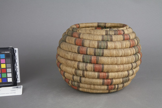 Hearst Museum object 2 of 2 titled Basket, accession number 2-22356, described as Coiled.  Fading red and green outlined in black diamond design.  Flat bottom, steep sides.