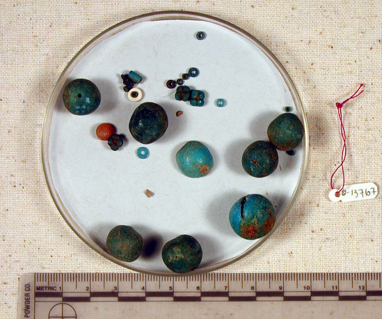 Hearst Museum object titled Beads, accession number 6-13767, described as Beads: 12 blue spherical, 1 white disc, 1 carnelian, 13 small discs. [inv.: 7.5 ball beads (faience), 1 carved carnelian shell, 4-lobed faience beads, original object count: 27?]