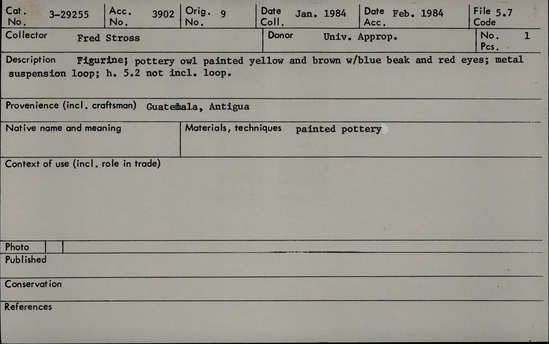 Documentation associated with Hearst Museum object titled Toy owl, accession number 3-29255, described as Figurine; pottery owl painted yellow and brown with blue beak and red eyes; metal suspension loop. Height 5.2 cm. not including loop.