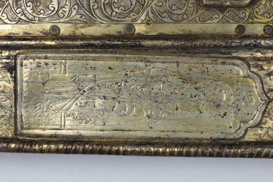 Hearst Museum object 44 of 49 titled Icon, accession number 7-3541, described as Icon of “Our lady of Vladmir”; Virgin and Child in tempera and gesso on wood; gilded silver basma; cloisonne halo with cloisonne collar pendant; halo has glass and amber (?) ornamentation; Virgin’s face damaged; height 30.2 cm, width 26 cm.