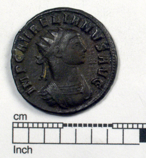 Hearst Museum object titled Coin: billon antoninianus, accession number 8-6117, described as Coin: Antoninianus, Silver (?) [or Æ]; Aurelian - 4.64 grams. Obverse: IMP C AVRELIANVS AVG - Bust facing right radiate, cuirassed. Reverse: CONCORDIA MILITVM - Emperor and Concordia clasping hands, [untranscribable symbols].