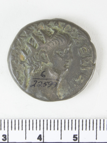 Hearst Museum object 4 of 6 titled Coin: billon tetradrachm, accession number 6-22599, described as obverse: head of Nero, right, radiate reverse: bust of Sarapais, right