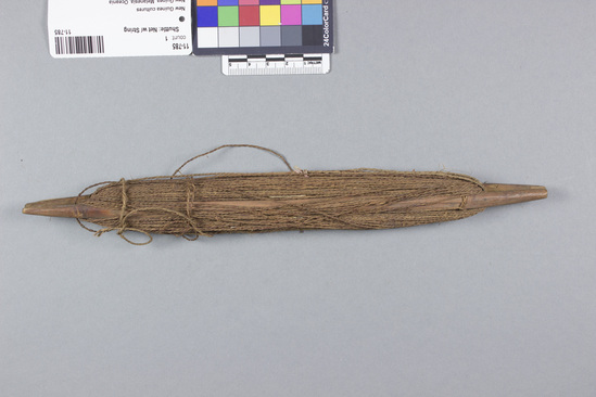 Hearst Museum object titled Shuttle: net w/ string, accession number 11-785, described as Netting shuttle with coconut string.