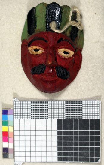 Hearst Museum object titled Toy mask, accession number 3-15585, described as Carved wooden toy mask; painted red face