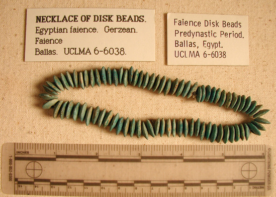 Hearst Museum object titled Bead, accession number 6-6038, described as Beads; Mass of large disc faience