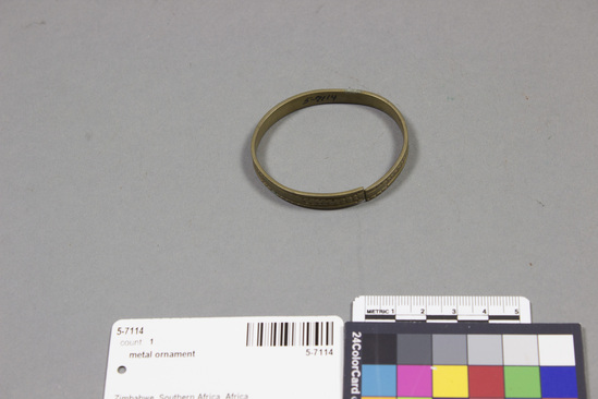 Hearst Museum object titled Bracelet, accession number 5-7114, described as Brass bracelet, 5 cms dia.