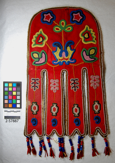 Hearst Museum object titled Pouch, accession number 2-57887, described as Beaded, front panel only; red wool flannel tradecloth with varicolored floral beadwork; 8 elongated appendanges (4 front and 4 behind), the front ones decorated with beadwork; pendant red and blue glass trade beads with red wool tassels; minor moth damage