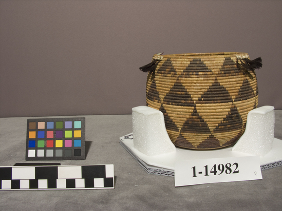 Hearst Museum object titled Jar basket, accession number 1-14982, described as Jar basket; coiled. Warp is Willow (Salix), weft is Sedge root (Carex). Brown pattern is Sedge root. Triangle pattern, quail plume and bead work near rim.