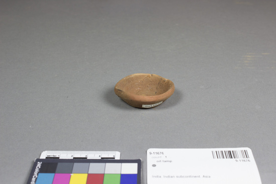 Hearst Museum object titled Oil lamp, accession number 9-11676, described as oil lamp with spout for wick. 5.7 cm.