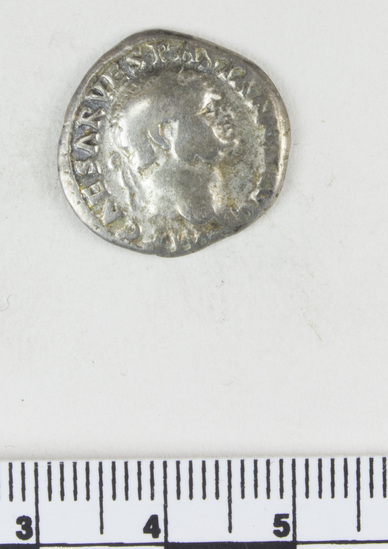 Hearst Museum object 6 of 8 titled Coin: ar denarius, accession number 8-4671, described as Coin; AR; Denarius; Roman. 3.11 grams, 19 mm. Vespasian, 69-70 AD. Rome, Italy. Obverse: IMP CAESAR VESPASIANVS AVG bust r. laureate. Reverse: COSITER TR POT, Pax seated l. holding caduceus and branch.