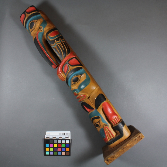 Hearst Museum object titled Totem pole model, accession number 2-30950, described as Totem pole model. Painted red, blue, black; top to bottom: mosquito, probably a supernatural bear (Hootz), otter.  Deals with origin myth of Mosquito clan--see acc. envelope.