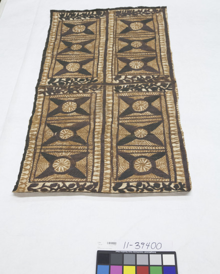 Hearst Museum object titled Tapa cloth, accession number 11-39400, described as Tapa; black and reddish brown pigments; design with field divided into four large rectangles by decorated bands, each smaller ones with motif; example of a type exchanged or given in a malanga (tour), i.e. a visiting of villages by a group and an exchange of gifts and shells, a meeting place of chiefs, talking chiefs, etc.; probably a wrapper (’afu) or a bedsheet (’afu loto)