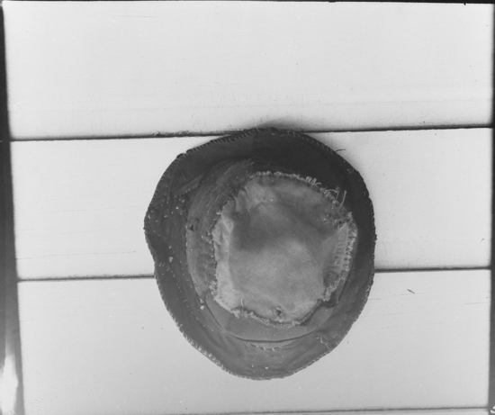 Hearst Museum object titled Black-and-white negative, accession number 15-5381, described as Hat, patched together from a variety of objects, 1-19581