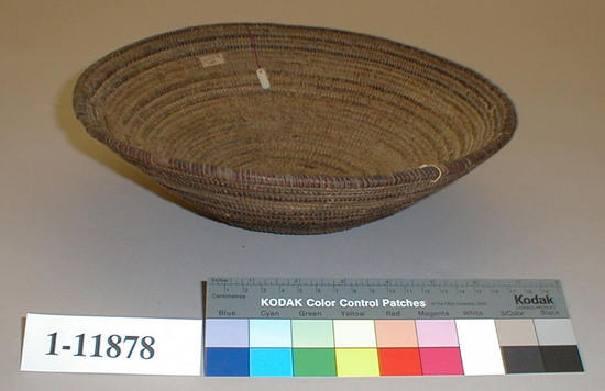 Hearst Museum object titled Cooking basket, accession number 1-11878, described as Small flaring coiled basket. Per Ralph Shanks:  Flaring coiled basket bowl, used, with food residue and a few burns.  The basket is in the shape of an under-sized Yuki cooking basket.  Tight spiral start.  The coil foundation is a mix of splints and rods.  The wefts are peeled and unpeeled redbud.   The rim is plain wrapped with a blunt ending with one back stitch.  The designs are one coil wide horizontal broken lines. The basket has an exterior workface, a rightward work direction, and the majority of wefts have a down to the right slant of weft twist.  The weft fag ends are primarily concealed.  The weft moving ends are tucked.  The weft stitches are often split.