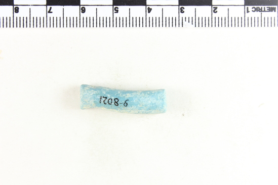 Hearst Museum object 5 of 8 titled Bracelet fragment, accession number 9-8021, described as Glass bracelet frag.; opaque light blue curved rod; 26 x 7 mm.