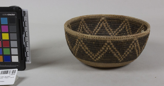 Hearst Museum object 3 of 3 titled Bowl basket, accession number 1-70510, described as Coiled, bowl shape.  Buff zigzag on black band.  Coiled with sedge root, buff-colored weft; rim herringbone stitched.