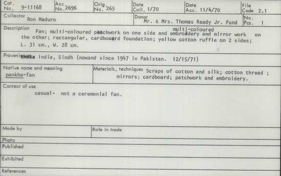 Documentation associated with Hearst Museum object titled Fan, accession number 9-11168, described as fan; multi-colored patchwork on one side and multi-colored embroidery and mirror work on the other; rectangular, cardboard foundation; yellow cotton ruffle on two sides.  Used as hanging. Length 31 cm, width 28 cm