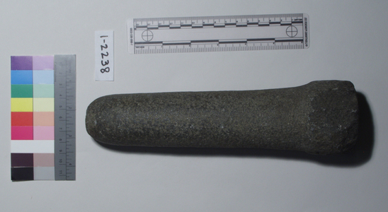 Hearst Museum object 1 of 2 titled Pestle, accession number 1-2238, described as Stone, cylindrical.  Straight, with raised band at distal end; pieces chipped off distal end.  Ground stone.
