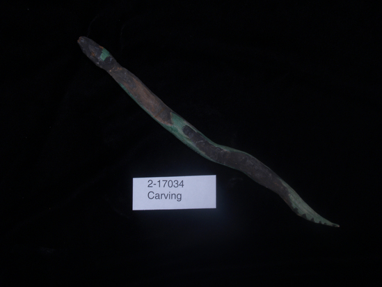 Hearst Museum object titled Figurine, accession number 2-17034, described as Carved wooden snake, painted with green stripes.