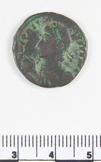 Hearst Museum object 3 of 18 titled Coin: æ sestertius, accession number 8-5644, described as Coin. Roman. Sestertius, Æ. (32 mm). M. Aurelius Caesar, AD. 152/3. Rome. Obverse: AVRELIVS CAESAR AVG PII FIL   Head facing right, bare. Reverse: TR POT VII .... Minerva (Greek: Athena) seated facing right, holding spear and drawing out aegis drapery(?), shield against chair; S C.