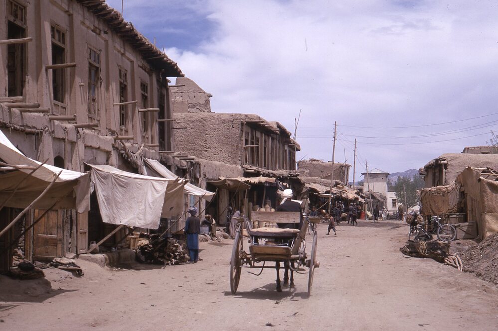 Hearst Museum object titled Color slide, accession number 25-31020, described as 35mm color slide transparency: carriage on road; buildings and stalls