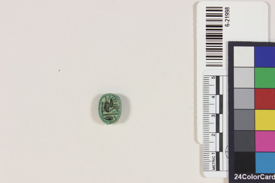 Hearst Museum object titled Scarab, accession number 6-21998, described as scarab, of green glaze; length 16 mm