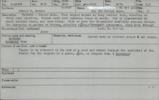 Documentation associated with Hearst Museum object titled Netsuke, accession number 9-12504, described as Netsuke: Carved bone.  Four legged animal with long curling tail, standing on thick oval platform.  Fiece eyes look upwards; fangs in mouth.  Fur is represented by small incised lines, and dark stain.  Side of base has bi-pointed leaf-like zig-zag design.  Two character signature on bottom, possible reading: “Donraku” (unknown).  Cord hole through bottom of platform