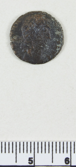 Hearst Museum object 4 of 6 titled Coin: æ, accession number 8-8594, described as Coin; bronze; obverse: head of Constantine I; reverse: standards between soldiers