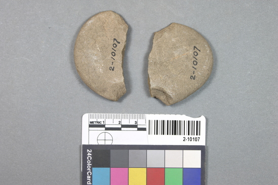 Hearst Museum object titled Net sinker, accession number 2-10107, described as Flat ovoid stone net sinker; notched at sides