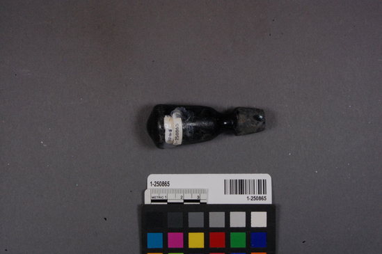 Hearst Museum object titled Stopper, accession number 1-250865, described as black glass stopper, whole