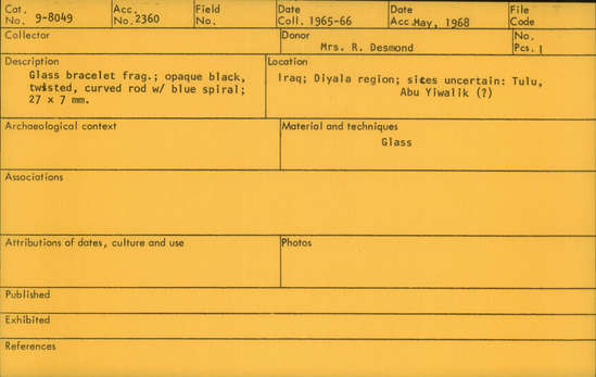 Documentation associated with Hearst Museum object titled Bracelet fragment, accession number 9-8049, described as Glass bracelet frag.; opaque black, twisted, curved rod w/ blue spiral; 27 x 7 mm.