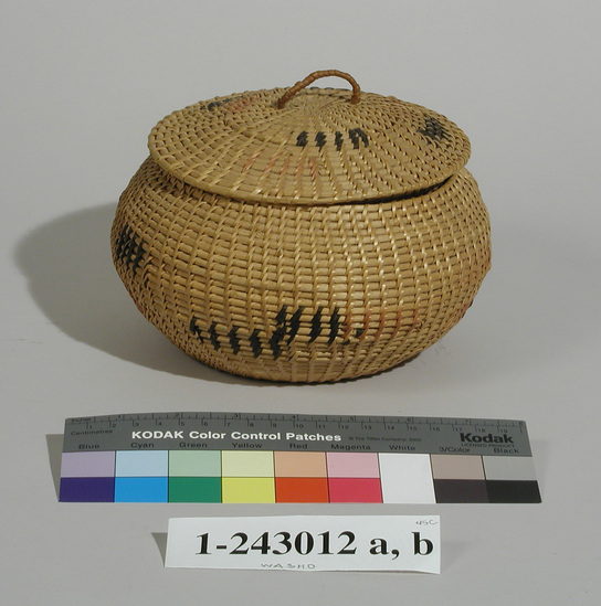 Hearst Museum object titled Basket and lid, accession number 1-243012a,b, described as a) Basket; one rod, coiled, flat bottom bowl shaped sides, widely spaced stitches, split/unsplit willow shoots, simple block designs in bracken fern root and red (comm. dye) willow.  b) Fitted lid; same construction and design as a), loop of twine & bark.