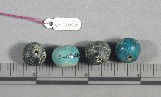 Hearst Museum object titled Beads, accession number 6-13488, described as Beads: 2 large blue spherical (ball), 2 large black spherical (ball).