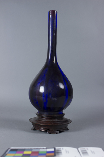 Hearst Museum object titled Bottle with stand, accession number 9-5143a,b, described as Blue and deep purple glaze porcelain, bottle shaped, 10” high, “ Ch’i’en Lung).