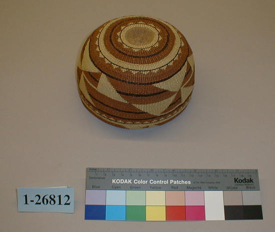 Hearst Museum object titled Cap, accession number 1-26812, described as Twined basketry cap. Height: 8.8 cm, Diameter: 16.3 cm