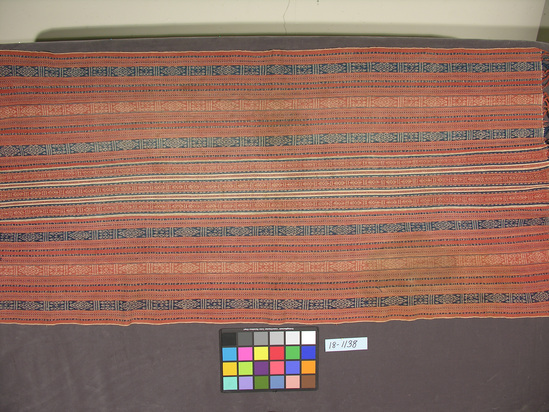 Hearst Museum object titled Shawl, accession number 18-1138, described as Shawl; cotton; warp faces pattern weave, fringed; varicolored; geometric motifs in warp stripes. 65 x 34 inches.