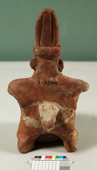 Hearst Museum object 2 of 2 titled Figurine, accession number 3-3596, described as Red pottery effigy of man playing drum