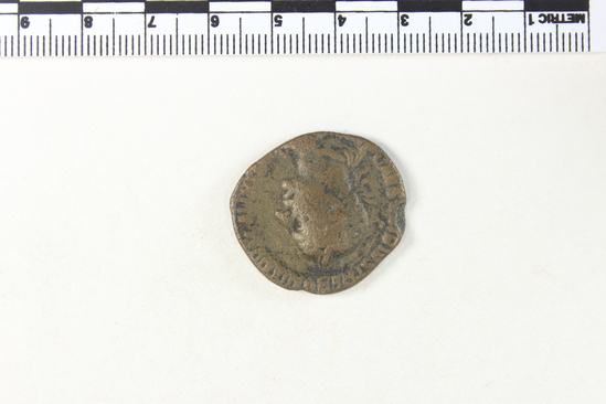 Hearst Museum object 7 of 8 titled Coin: æ sestertius, accession number 8-6009, described as Coin: Once sestertius (?); Æ; Trebonianus - 11.66 grams. Obverse: [IMP]CAESVIBIVS TREBONIANVS GALLVS AVG - Bust facing right, draped, laureate. Reverse: IVNONIMAR[TIALI], SC - Juno seated front in round distyle temple: at her side, peacock.