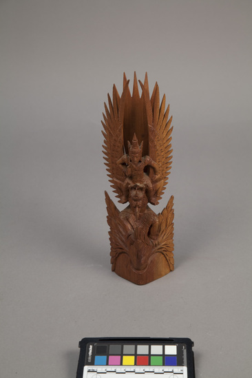 Hearst Museum object titled Figurine, accession number 18-288, described as Wooden carving of Rama riding on “Garuda.” Height 10 1/2 inches.