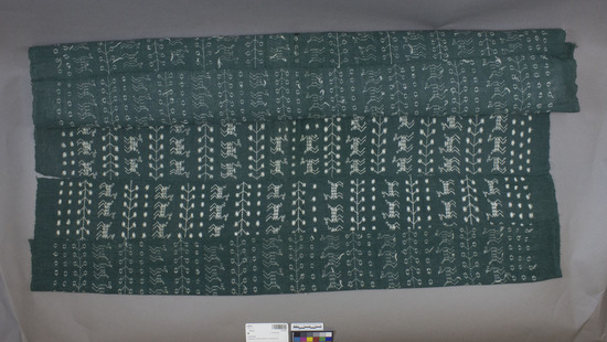 Hearst Museum object titled Huipil, accession number 3-28142, described as [ cat card DESCRIPTION: Blouse Materials: Cotton,  Technique: Plain weave,  brocaded Colors: Green ground, white designs Dimensions: 19 x 37" Remarks:  Animal, leaf, dot motives. See Fig. 100b Textiles of Highland Guatemala, LMO    ]