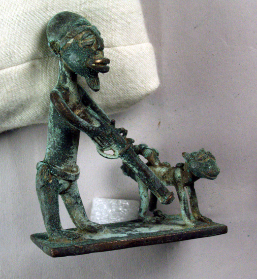 Hearst Museum object 2 of 2 titled Gold weights, antelope, accession number 5-10489, described as Gold weight, brass, lost wax cast; man shooting leopard, 107.35 gm. weight called perequan asoanu.