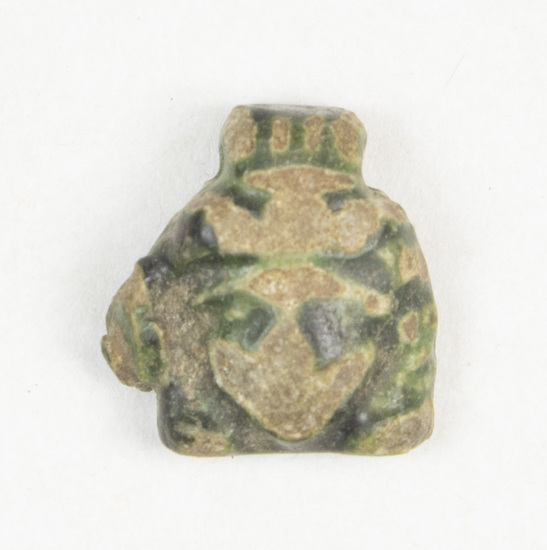 Hearst Museum object 4 of 6 titled Amulet, accession number 5-13971, described as Amulet: anthropomorphic, head with much of features worn off. Greenish glaze on eyes, top of head and back of head.