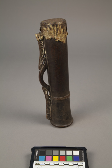 Hearst Museum object titled Drum, accession number 11-916, described as Small wooden drum with lizardskin head; carved handle with lime-filled incised design; incised band of zig-zag motif rings drum.