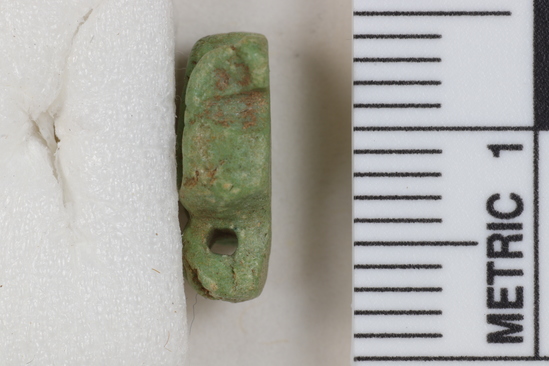 Hearst Museum object titled Uraeus amulet, accession number 6-22048, described as Uraeus amulet, of green glaze; 8x12 mm