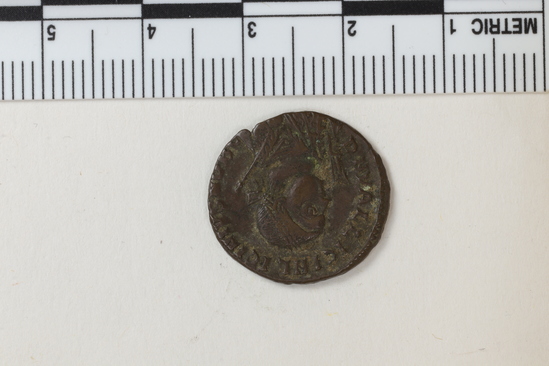 Hearst Museum object titled Coin: æ, accession number 6-17243, described as Bronze coin, Roman, marked “Constan”. Obverse: Licinius. Reverse: figure with many objects.