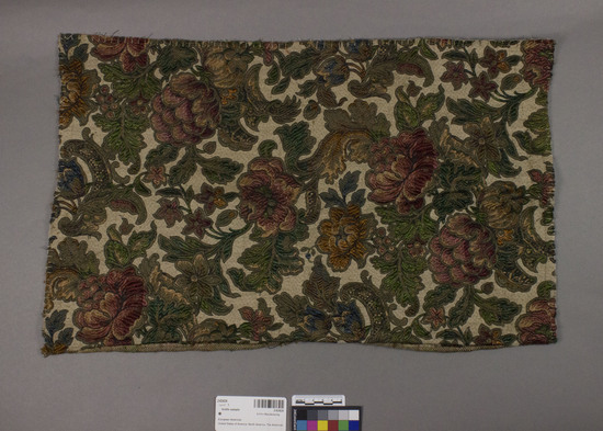 Hearst Museum object titled Textile sample, accession number 2-62424, described as Strip; cotton, rayon, metal wrapped yarns, damask, varicolored, floral and leaf motives, Jacquard looms